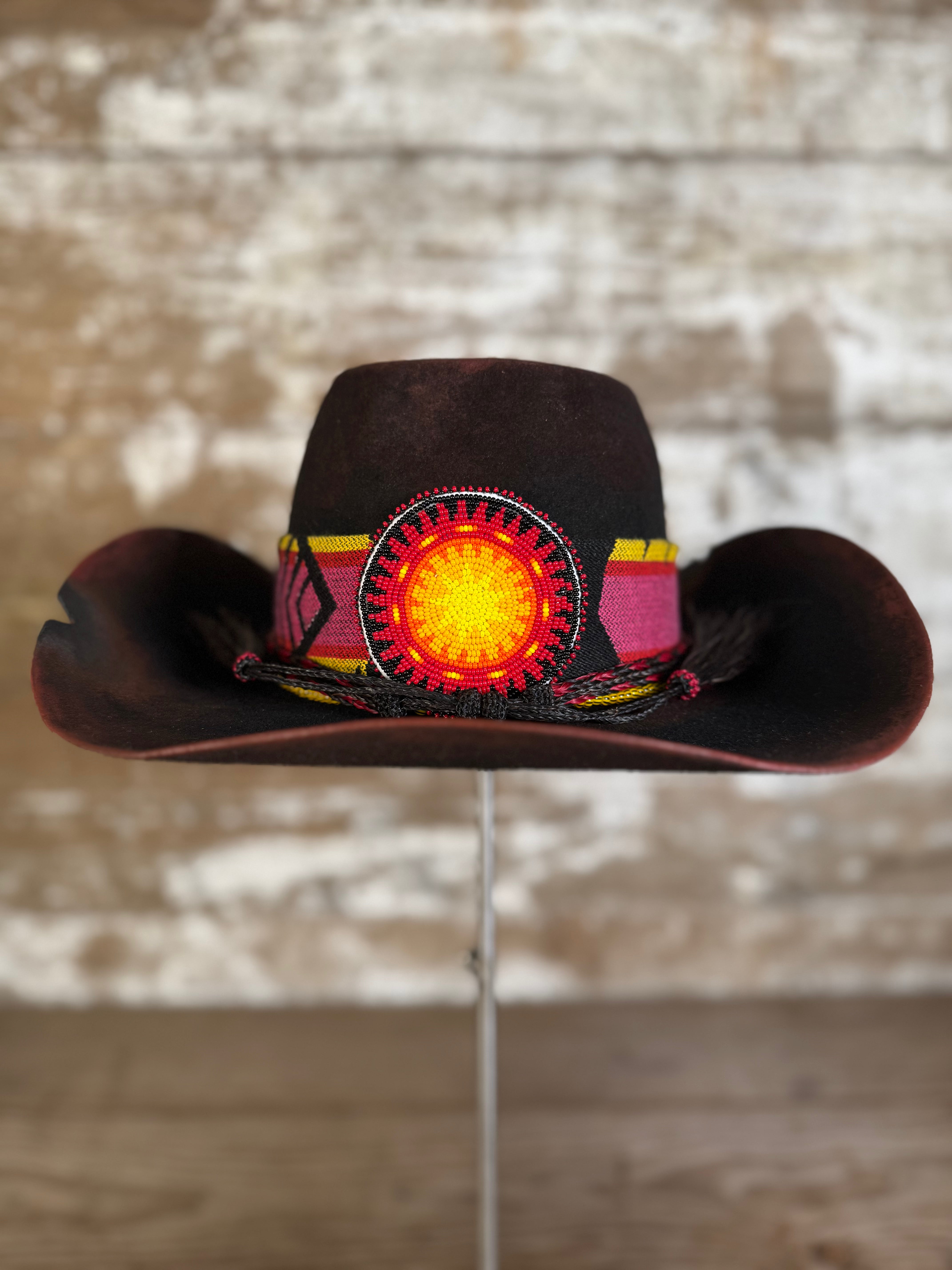 Back view of felt hat in deep red-brown with coffin crown, relaxed taco brim, Pendleton wool band, horsehair tie, Columbia Plateau sunburst beading, and vintage African trade beads.