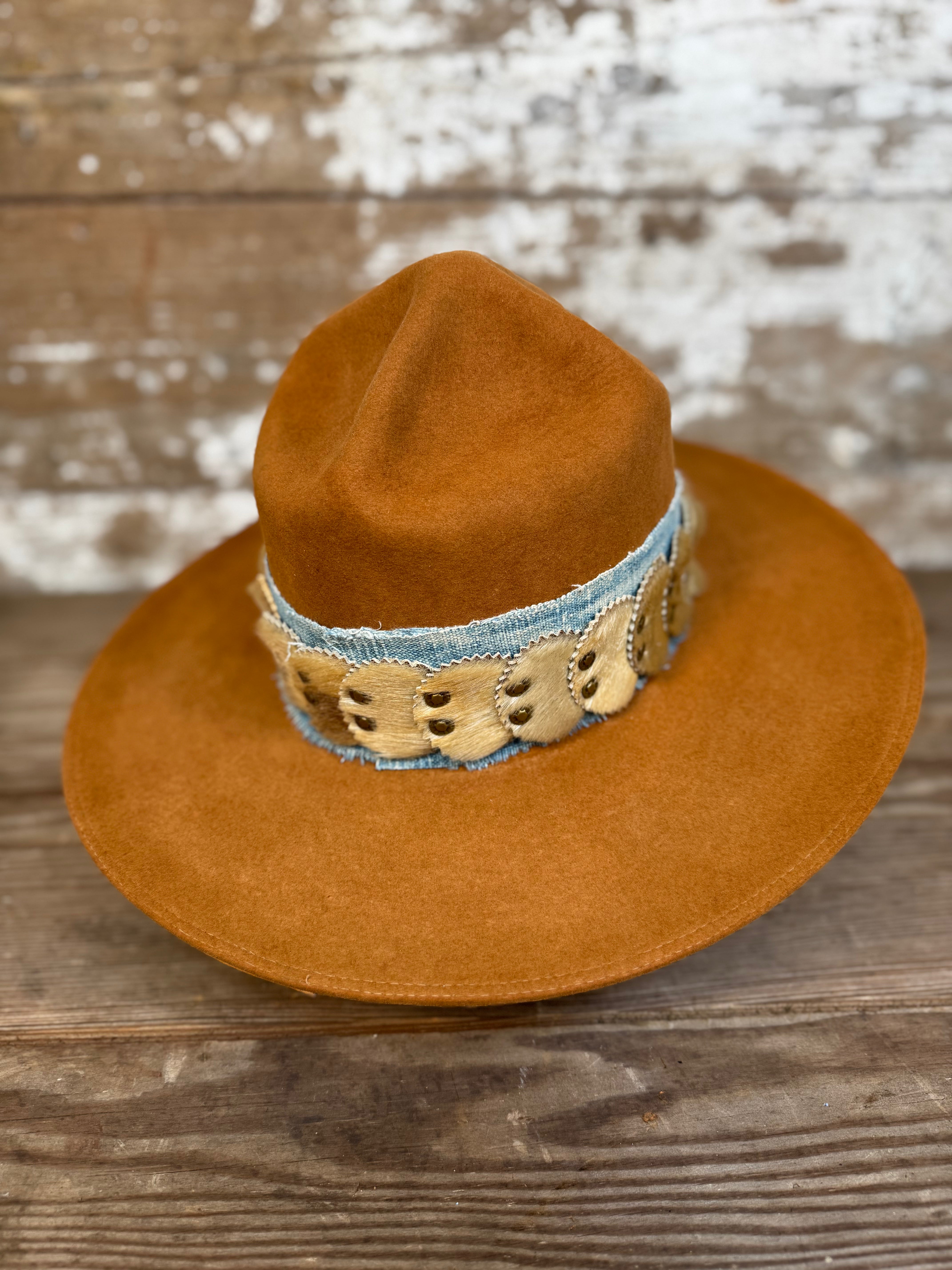 Front view of Solar Communion reclaimed beaver felt hat with denim and fur band, hand-shaped with brass sun detail and wide brim, crafted in Oregon.