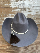Back view of Decent Trouble hat in charcoal felt with knotted rawhide tassel.