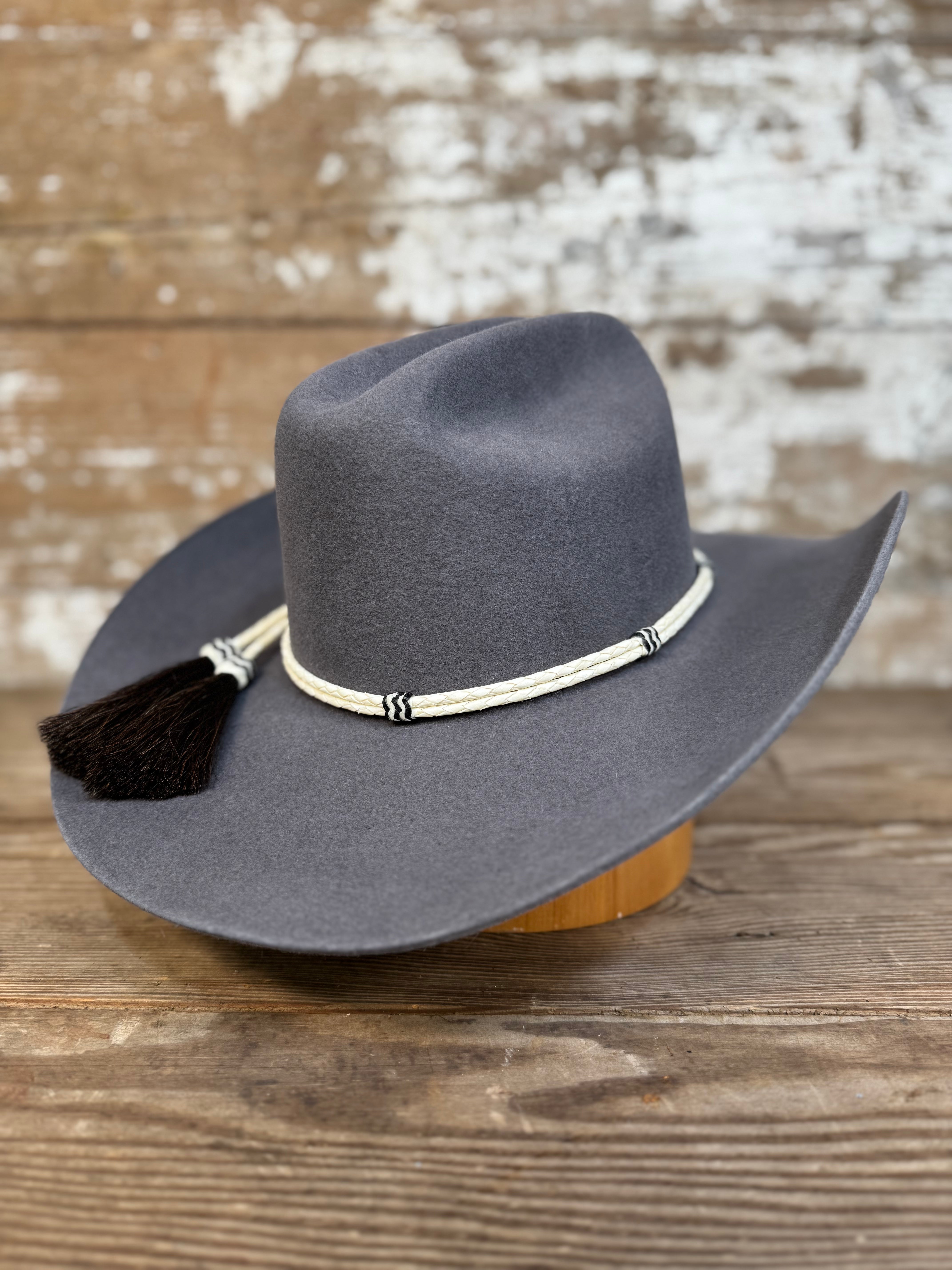 Side view of Decent Trouble charcoal felt cowboy hat showing 4-inch brim and rawhide band.