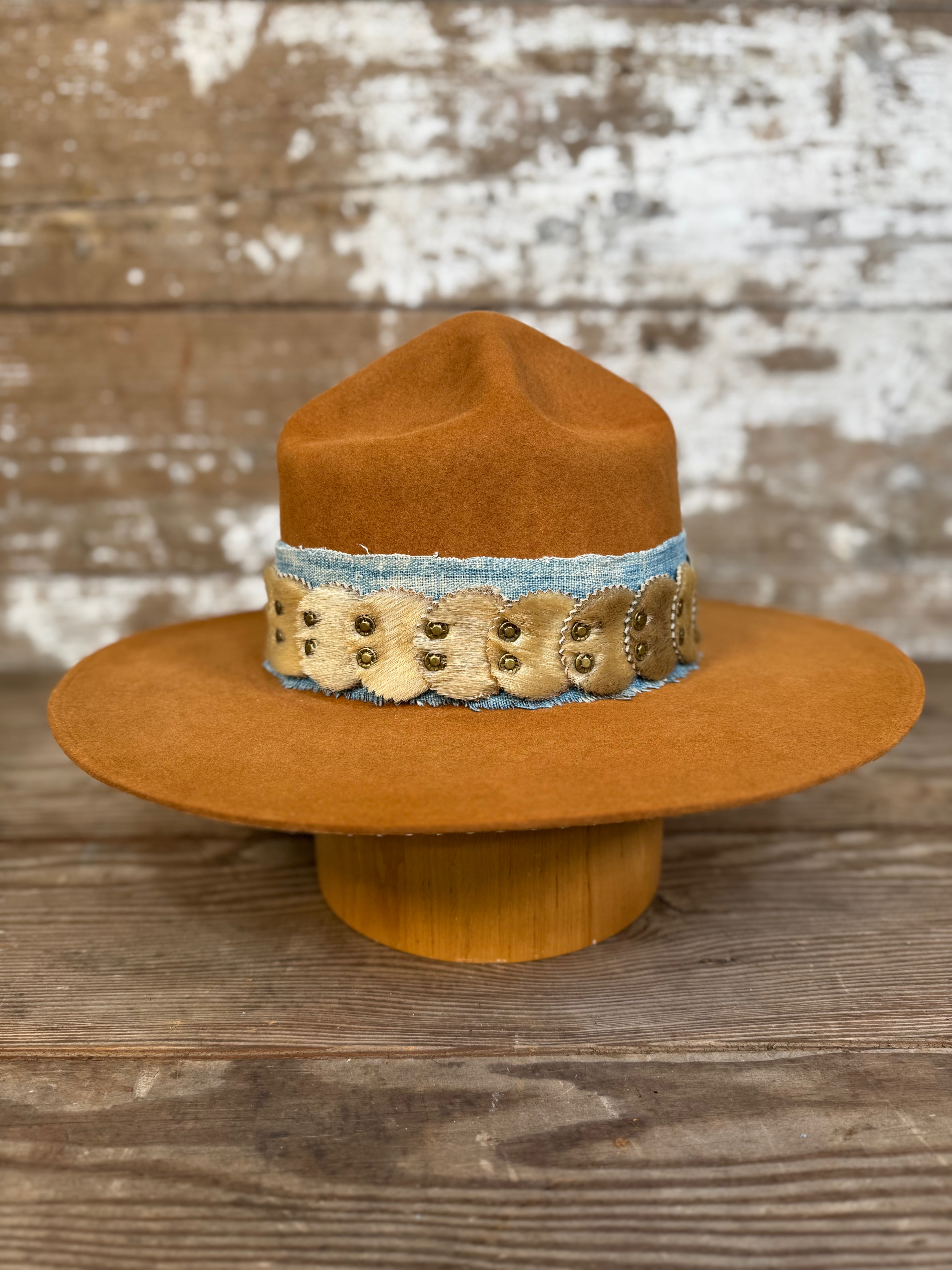 Solar Communion hand-shaped reclaimed beaver felt hat with denim-and-fur band and brass solar accent, handmade in Oregon.