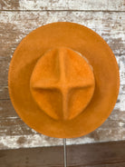 Top view of Solar Communion hand-shaped reclaimed beaver felt hat with denim-and-fur band and brass solar accent, handmade in Oregon