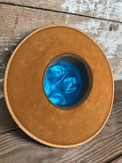 Liner view of Solar Communion hand-shaped reclaimed beaver felt hat with denim-and-fur band and brass solar accent, handmade in Oregon