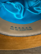 Sweatband of Solar Communion hand-shaped reclaimed beaver felt hat with denim-and-fur band and brass solar accent, handmade in Oregon