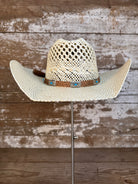 Front view of Wallowa Wind straw cowboy hat with horsehair band and silver arrow pin, handmade in Oregon